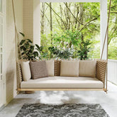 Porch Hanging Rattan Swing Sofa with Shiny Khaki Cushion Pillow for Outdoor Comfort and Relaxation